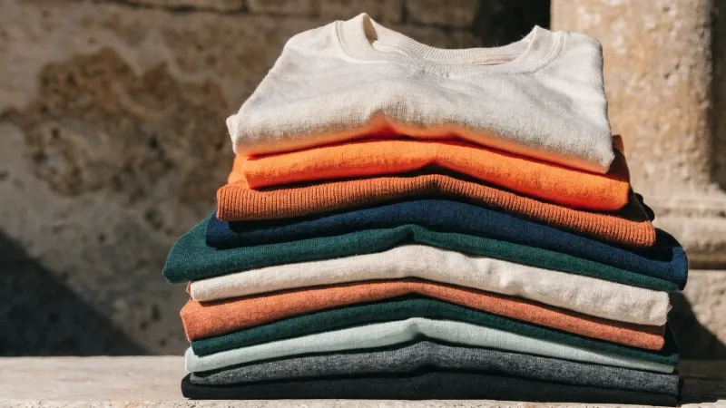 A stack of T-shirts ranging from lightweight to heavyweight for brand clothing