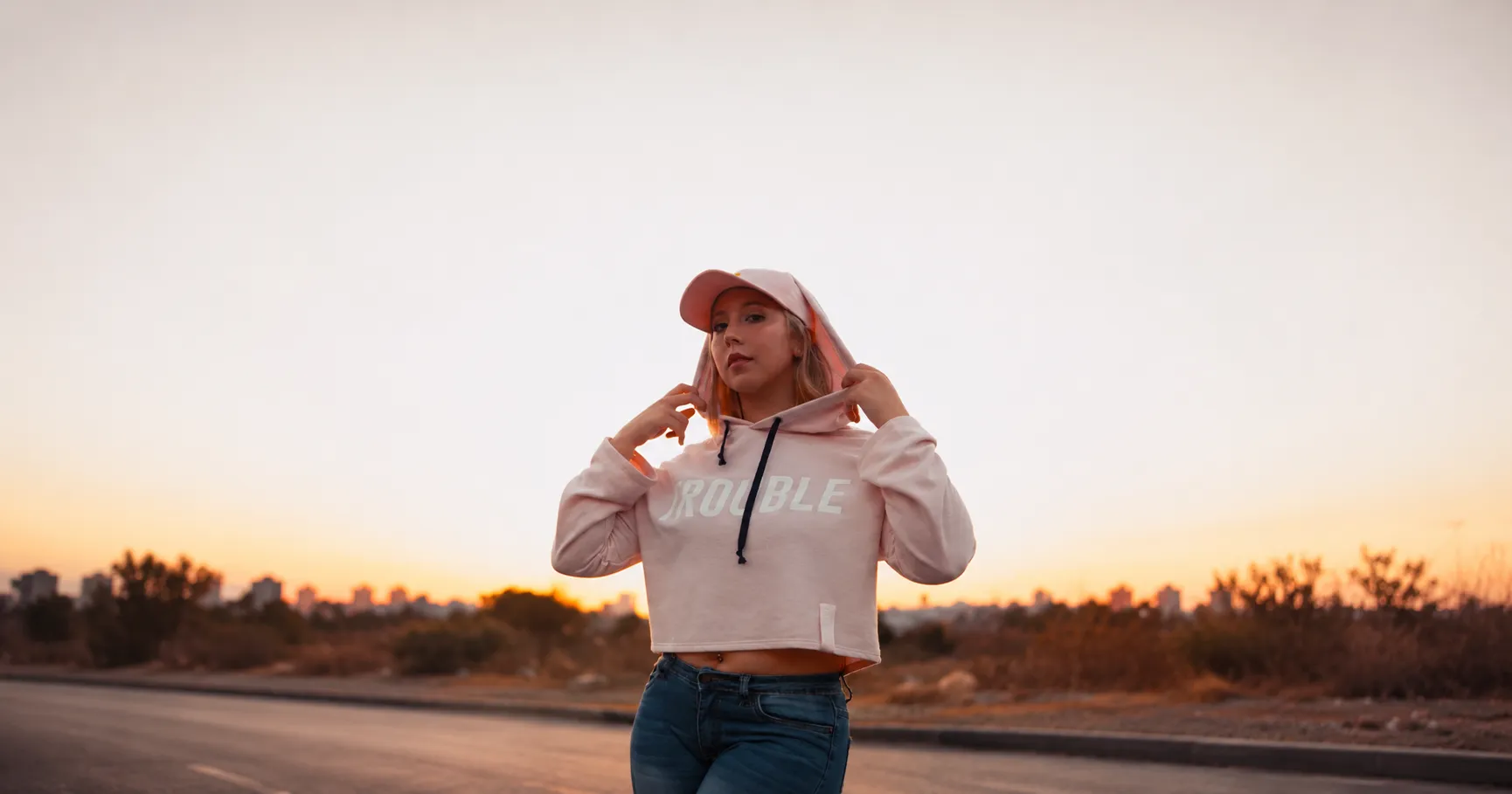 a women in cropped hoodie